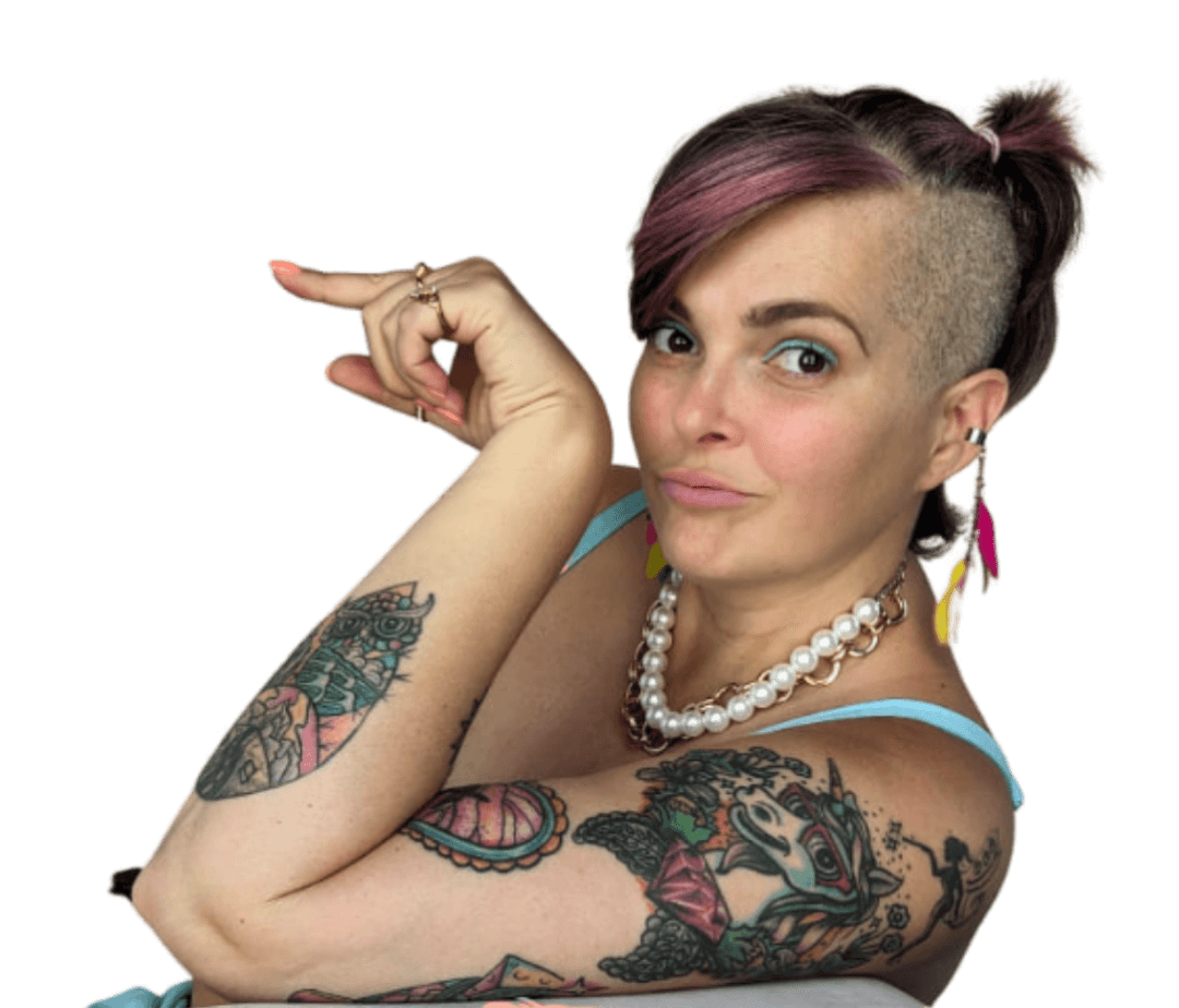 Side view head and shoulder portrait of a young woman with a tattooed arm looking into the camera pointing to the left